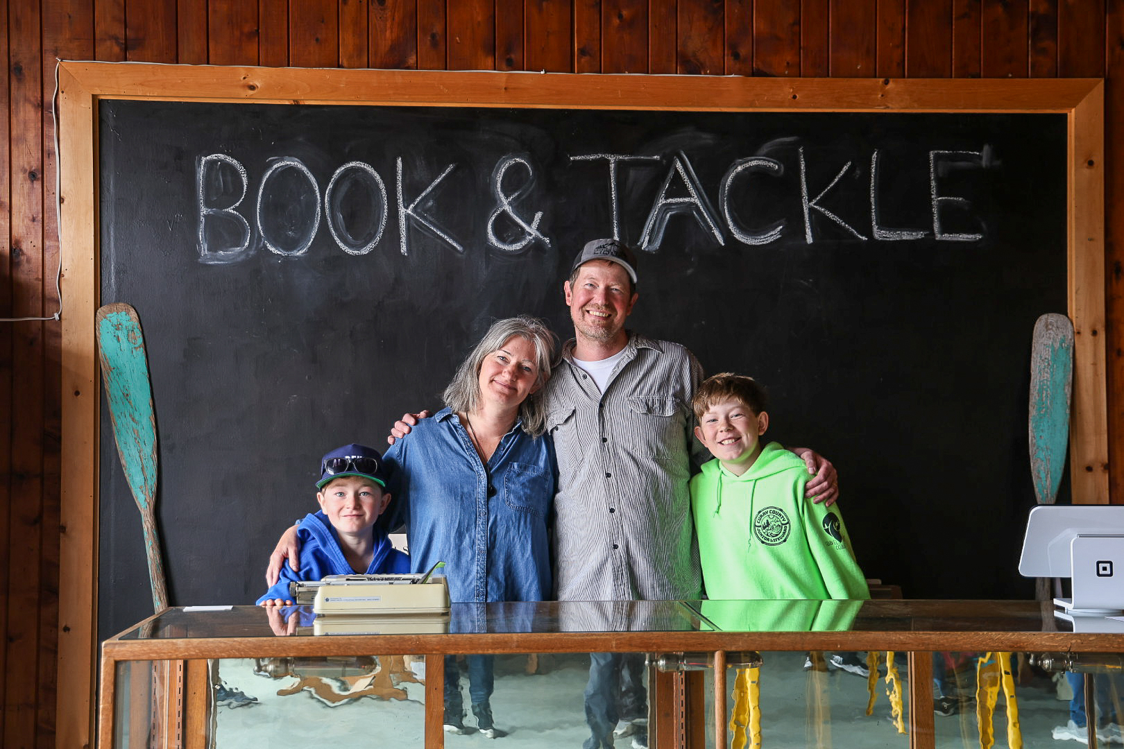 Family portrait at Book and Tackle shop in Port Orford