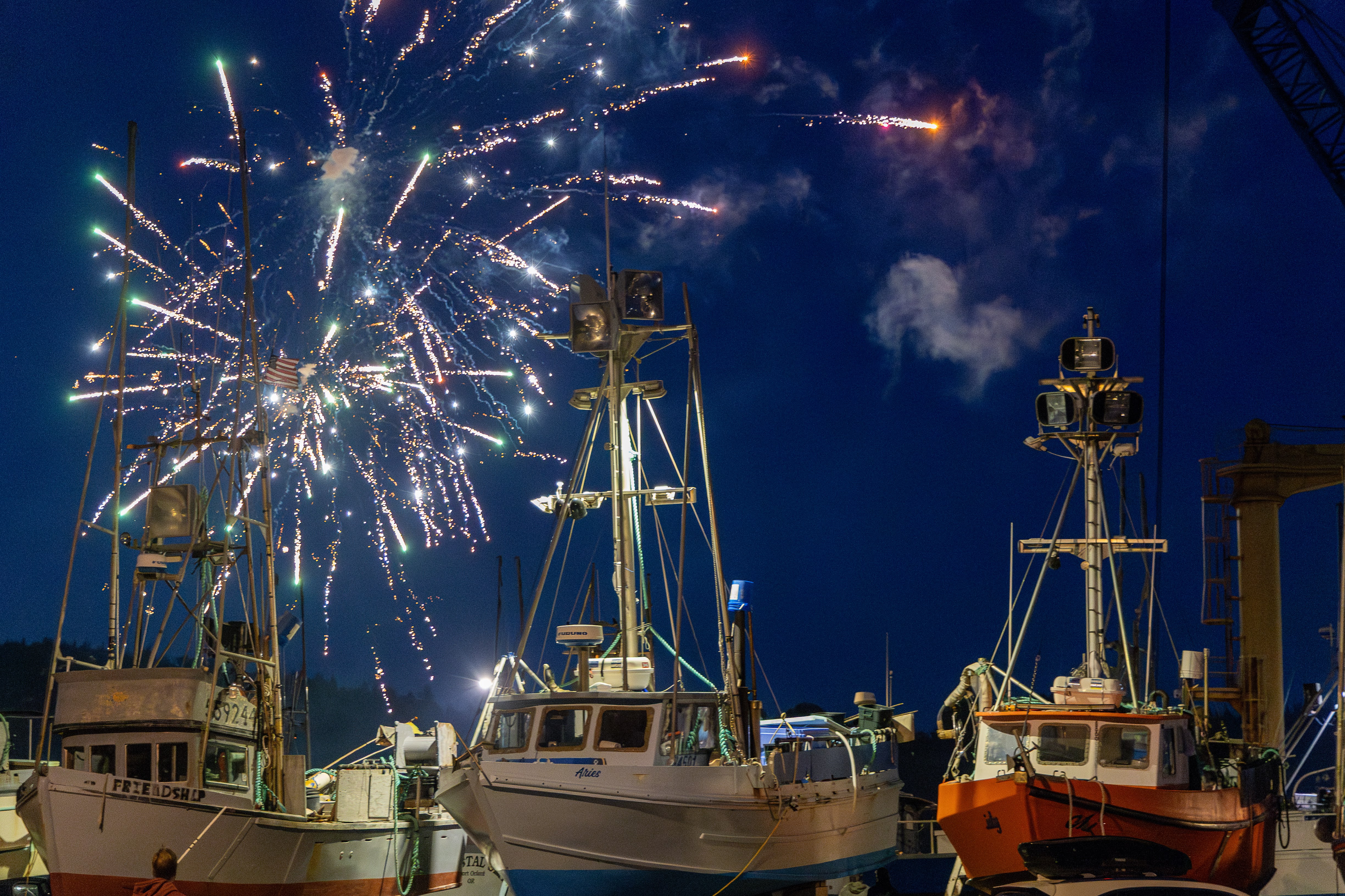 Fourth of July fireworks over fishing boats at Port Orford harbor